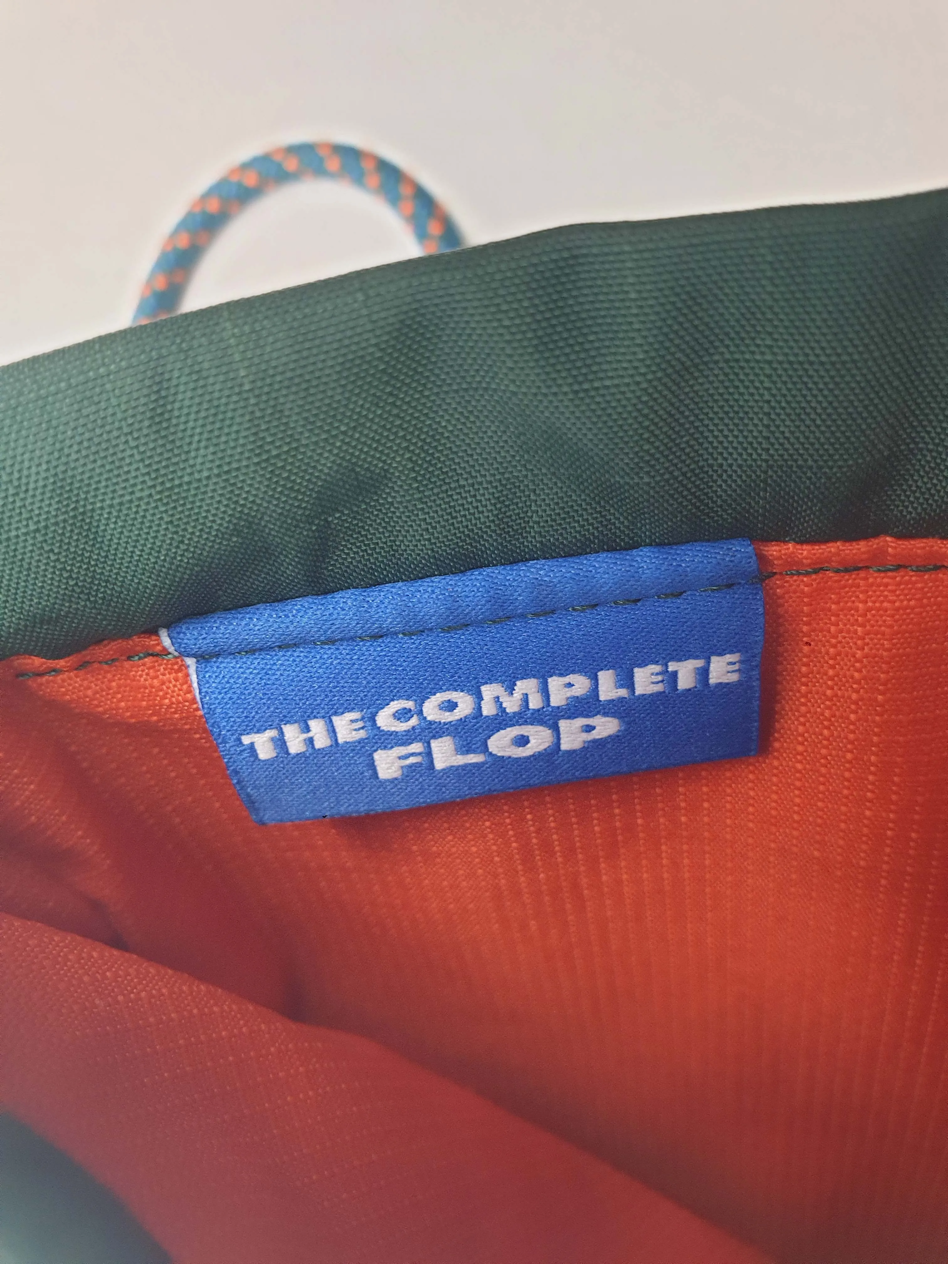 Crumpler green "the complete flop" mini cross body bag