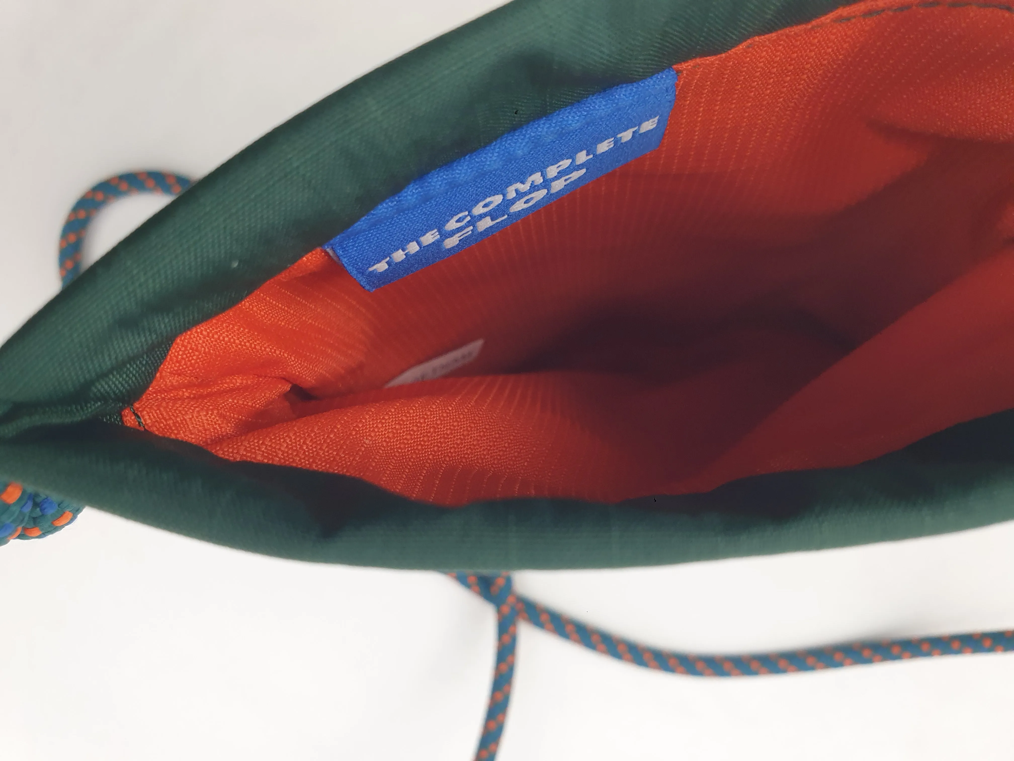 Crumpler green "the complete flop" mini cross body bag