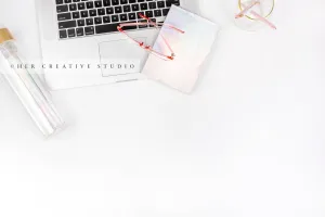 Glasses on Iridescent notebook Flatlay