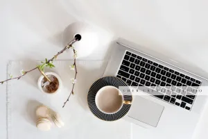 Laptop, Coffee & Spring Twigs. Styled Image.