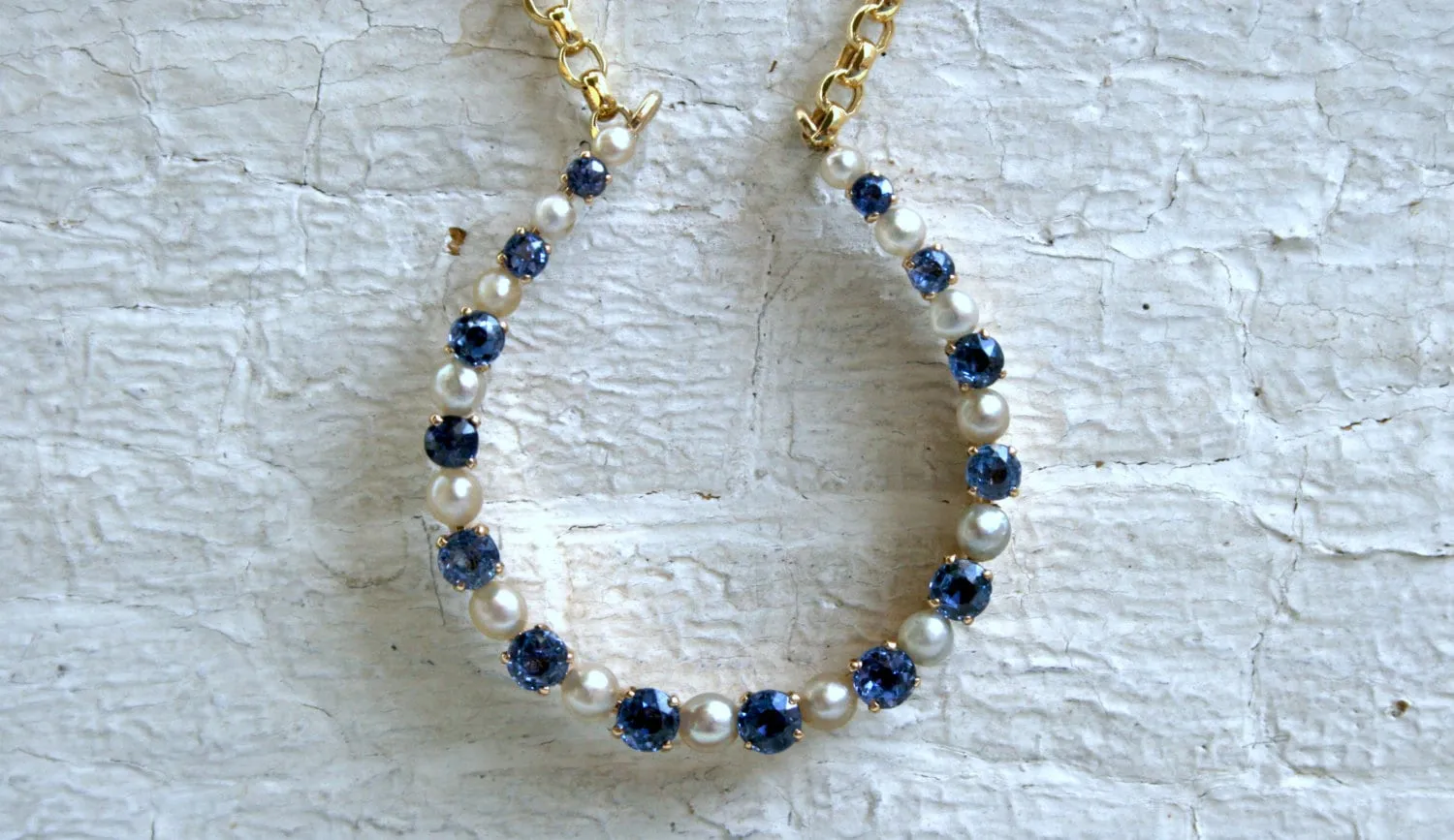 Vintage 14K Yellow Gold Pearl and Sapphire Horseshoe Necklace.